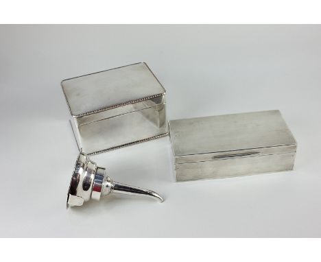 A George V silver rectangular cigarette box, with engine turned decoration, 18cm, London 1924, a silver plated dressing table