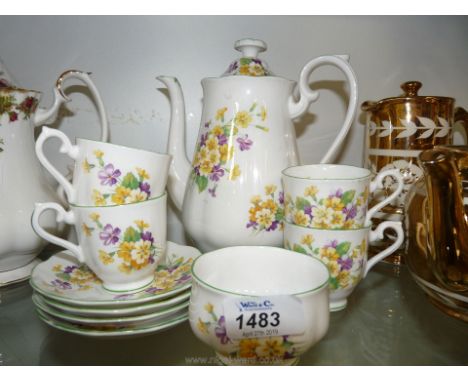 A Royal Albert bone china Primulette pattern part Coffee service to include; coffee pot, four cups and saucers and sugar basi