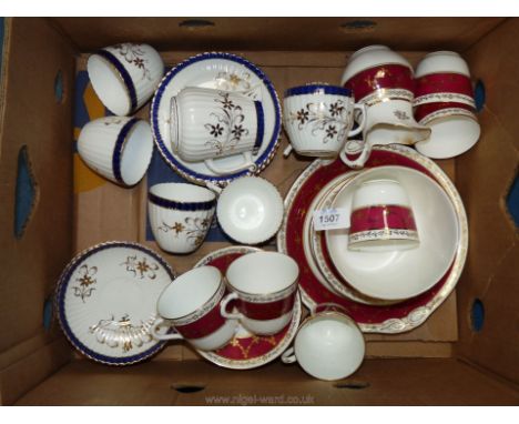 A blue and gold patterned part tea set including six cups and saucers, milk jug a/f and six tea plates, along with red and go