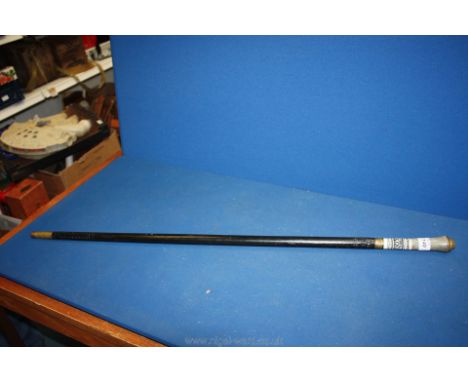 An ebonised Indian Swordstick having a brass and steel ferule, the grip terminating with a lion's mask, 36'' long, 30 5/8'' l