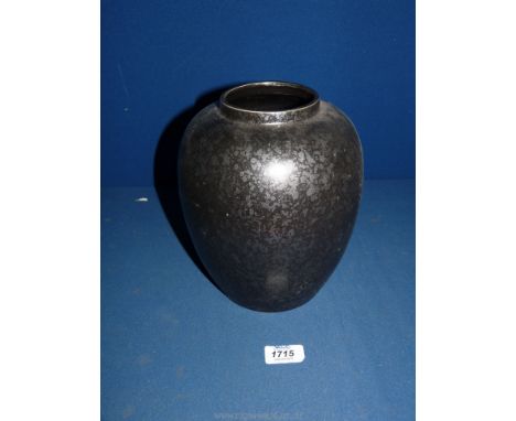 A dark grey mottled Poole Pottery Vase.