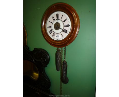 A Black Forest wall hanging alarm Clock with pendulum.