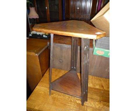 A triangular Satinwood arts and crafts occasional Table having angled fretworked legs mounted by a lower shelf, the top 16'' 