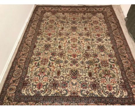 A fine hand-made Tabriz Carpet (12'7" by 9'16").