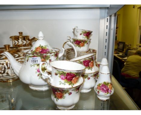 A Royal Albert 'Old Country Roses' part Teaset comprising six each cups, saucers, tea plates, large tea pot and cake plate.