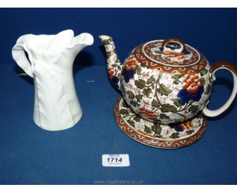 An old Royal Doulton Teapot and stand pot no. D222GF (some chips to rim of teapot lid) and a Royal Worcester leaf design Jug