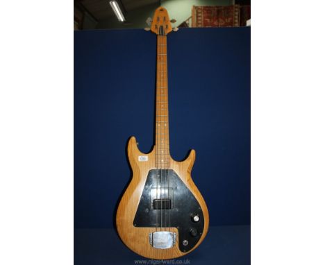 An electric base Guitar, solid wood, four strings.