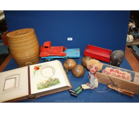A Hansel Pelham puppet, tin lorry and two tin trailers, three wooden croquet balls, pictorial antique photograph album etc.