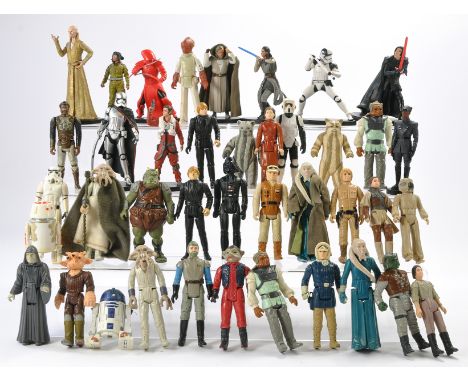A group of Star Wars figures including some vintage issues in addition to more modern series pcs. As shown. 