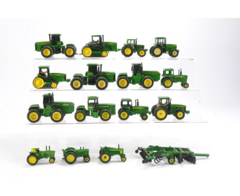 A group of 1/64 Ertl John Deere Tractor issues (plus a couple of implements). 
