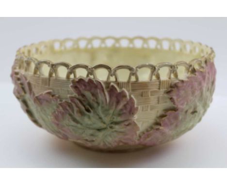 A LATE VICTORIAN ROYAL WORCESTER PORCELAIN BOWL, having reticulated rim, basket weave moulded with hand painted vine leaves, 