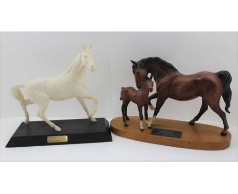 A BESWICK "SPIRIT OF AFFECTION" CERAMIC HORSE &amp; FOAL FIGURE, mounted upon a polished mahogany base, the plinth 32 cm wide