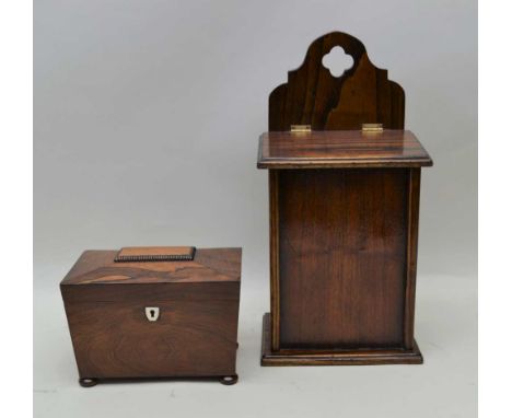 A 19TH CENTURY ROSEWOOD SARCOPHAGUS SHAPED TEA CADDY on bun feet, 15cm x 20cm, together with a wall mountable lidded CANDLE B