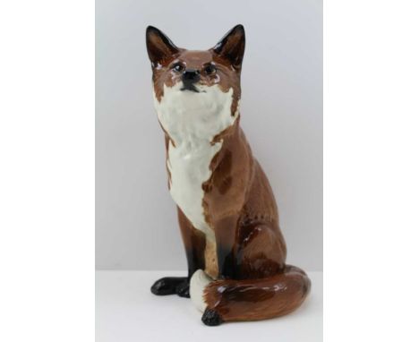 A BESWICK CERAMIC SEATED FOX, impressed factory marks to base, include "Beswick" and the number "2348", 31cm high 