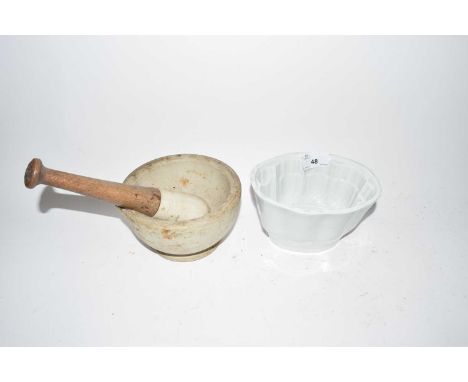 Pestle and mortar and a ceramic jelly mould 