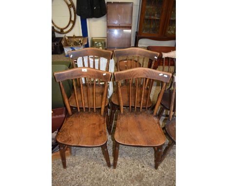 Set of four late 19th or early 20th Century elm seated stick back kitchen chairs