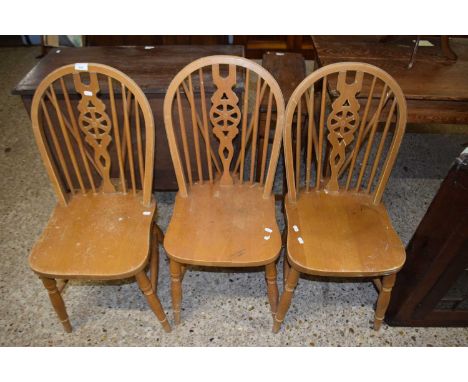 Three stick back kitchen chairs