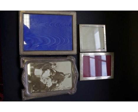 Four various modern silver easel photograph frames 