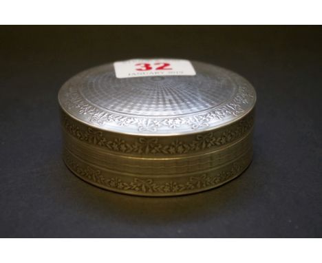 A silver circular engine turned box,&nbsp;by William Base &amp; Sons, Birmingham 1922, 7.5cm diameter, 80.5g. 