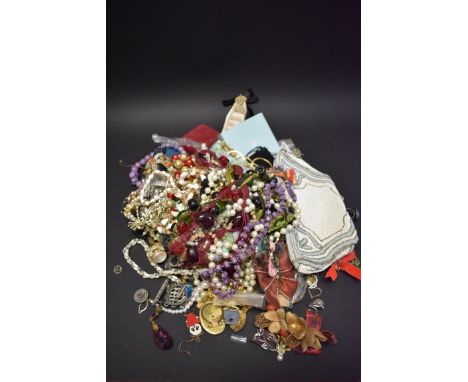 A bag of costume jewellery; together with a beaded purse; and a Past Times compact. 