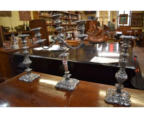 A pair of Georgian style silver plated candlesticks, 33cm; together with a similar plated candelabra, 45cm. 