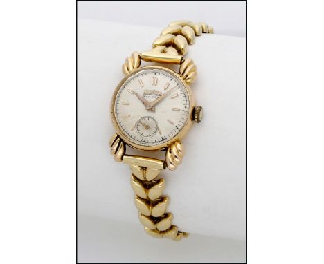 Herodia. A lady’s gold wristwatch with bracelet, circa 1950 Movement: manual winding Dial: silvered, applied baton indexes, s