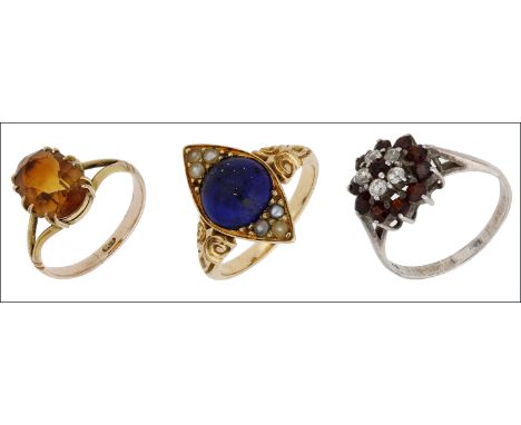 Three gem-set rings, comprising a citrine single stone ring, a late 19th century lapis lazuli cabochon and seed pearl ring, m