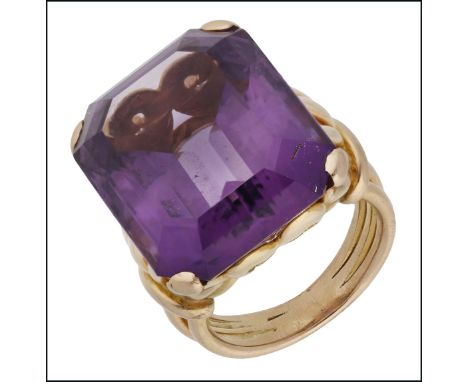 An amethyst dress ring, claw-set with an octagonal step-cut amethyst to a scroll work mount with fanned shoulders, to a trifu