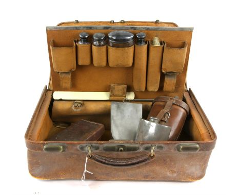 Leather Gladstone travelling case by Mappin Brothers, with silver topped glass bottles hallmarked Charles Henry Dumenil, Lond