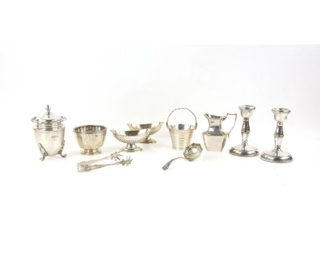 Various small silver items comprising, pair of dwarf candlesticks, pair of oval salts , a small tea caddy and cover, small ju