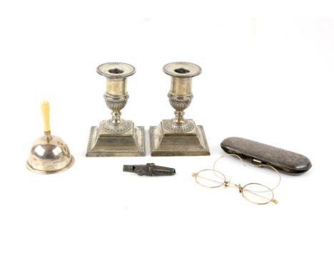 Pair of Edward VII silver dwarf candlesticks, London 1903 H11cm, silver bell with ivory handle, Chester 1906,  glasses case w