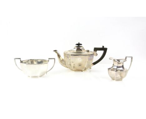 George V three piece silver tea service, by Viners, of octagonal tapering form, London and Sheffield 1935, teapot 16 cm high,