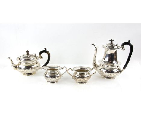 Four piece baluster tea service, with beading and gadrooning, possibly Indian, marked Sterling Silver, coffee pot 23 cm high,