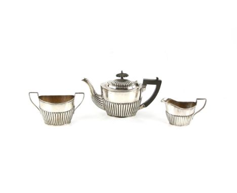 Edward VII three piece silver tea service, of gadrooned boat form, Birmingham 1901, teapot 11 cm high, total weight 12 oz