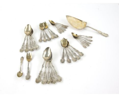 Set of eleven American silver cast spoons, depicting figures on a column, engraved initials to the back, marker's marks for G