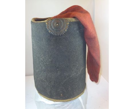 An extremely rare Hussar type black felt busby c 1805, with red bag, black leather cockade, original leather and linen lining