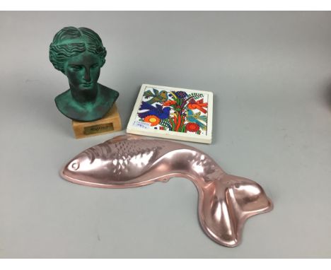 THREE JELLY MOULDS, one modelled as a fish, along with ceramic tiles and a miniature bust on stand