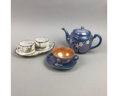 EARLY 20TH CENTURY JAPANESE PORCELAIN TEA SERVICE, painted with white and green flowers in enamels, on a blue ground, compris