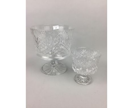 TWO GRADUATED CUT GLASS PEDESTAL BOWLS, the largest 27cm high and 24cm diameteralong with a cornucopia vase, another bowl and