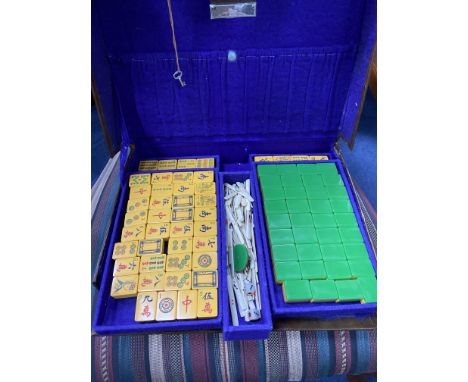 MAHJONG SET IN LEATHER TRAVEL CASE, along with wooden counter stands and accessories