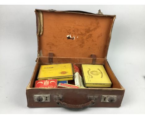 COLLECTION OF VINTAGE CIGARETTE TINS, in a vintage suitcase, along with three stamp albums