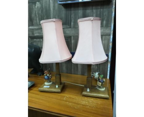 PAIR OF HUMMEL TABLE LAMPS, with pink shades, 45cm overall, along with another table lamp (3)