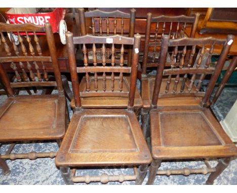 A SET OF FIVE ANTIQUE SPINDLE BACK OAK PANEL SEAT CHAIRS. 