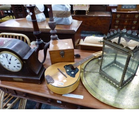 AN EDWARDIAN MAHOGANY INLAID MANTLE CLOCK, TWO TRIPOD TABLE BASES, A MANDOLIN, A BRASS HALL LANTERN AND A BRASS TRAY. 