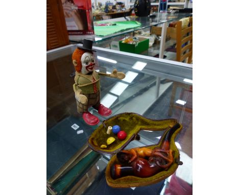 A WIND UP TOY SCHUCO CLAPPING CLOWN AND A MEERSHAUM PIPE IN CASE. 