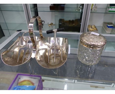 A SILVER PLATED CONDIMENT DISH, A BREAD FORK IN THE MANNER OF CHRISTOPHER DRESSER, ONE OTHER FORK, AND A SILVER LIDDED DRESSI