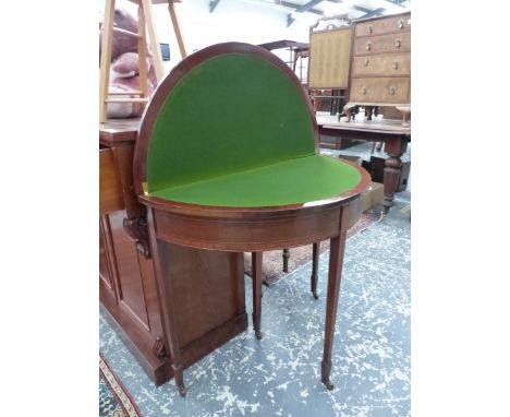 AN EDWARDIAN MAHOGANY AND INLAID FOLD OVER CARD TABLE. DIAMETER 84 X H 75CMS 