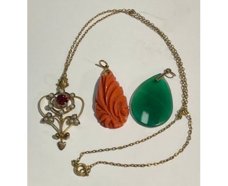 A gold coloured metal mounted coral pendant; a Jade pendant; an Art Noveau pendant necklace (3) 