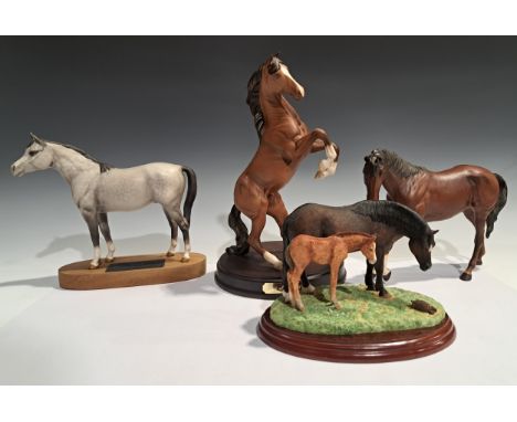 A Beswick model, of a rearing horse, Spirit of the Wild, circular wooden base, matte glaze, 30cm high; a Connoisseur model, o