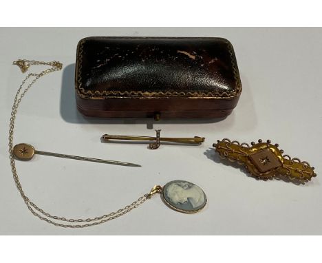 A 19th century 9ct gold brooch, set with a diamond chip, 4cn, 3.7g; a 9ct gold bar brooch the letter "J" set with seed pearls